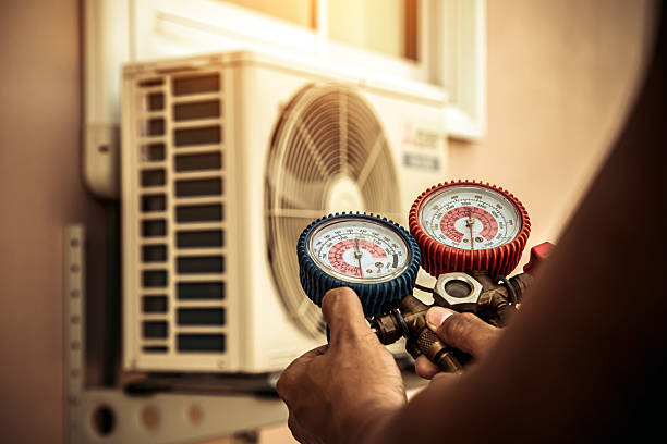 Professional Air Conditioning Service technician working in Yuma, TN